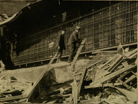 Fire Chief Allen Nice and another firefighter survey damage caused by the tornado that leveled the jail’s west wing on May 2, 1929.
